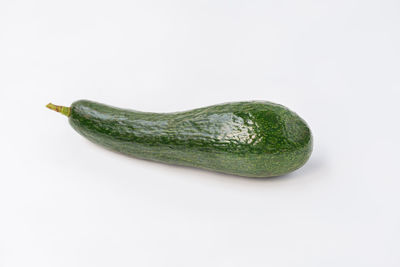 High angle view of green pepper against white background
