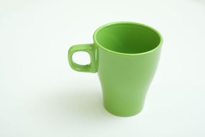 Close-up of coffee cup against white background