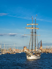 Ship in sea against blue sky