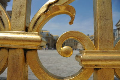 Close-up of gold colored metallic gate at park