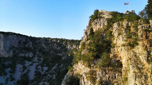 Scenic view of mountains against blue sky