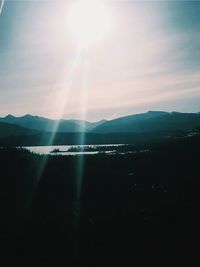 Scenic view of silhouette mountains against sky