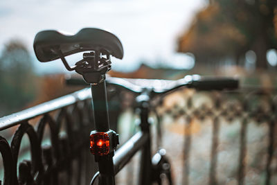 Close-up of bicycle on railing