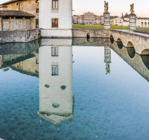 Reflection of old building in lake