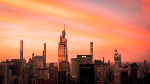Modern buildings in city against sky during sunset,new york