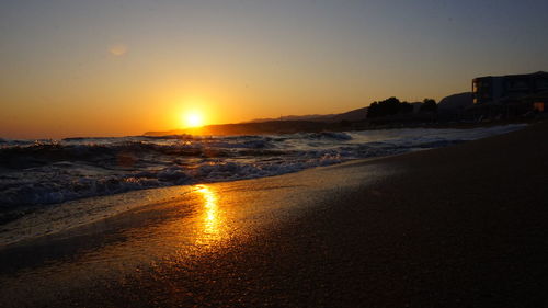Scenic view of sea against clear sky during sunset