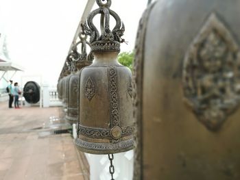 Close-up of cross hanging on metal