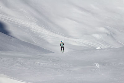 Woman skiing on snowcapped mountain 