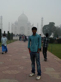 Rear view of people walking in temple