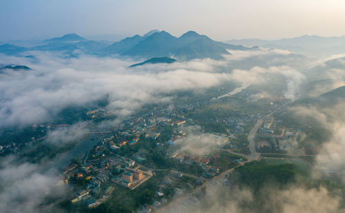 Aerial view of cityscape against sky