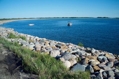 Scenic view of sea against clear blue sky