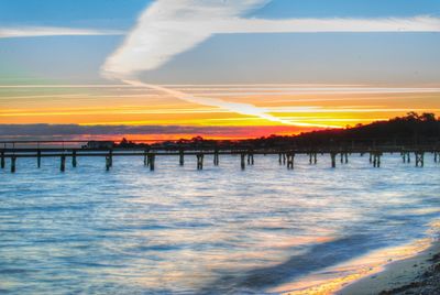 Scenic view of sea at sunset