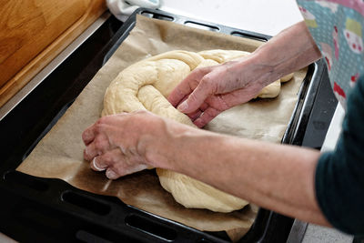 High angle view of man preparing food in kitchen