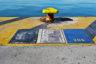 High angle view of bollard at harbor