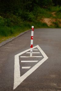 Arrow sign on road