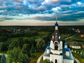 High angle view of trees and buildings against sky