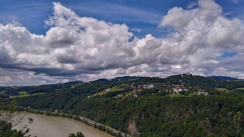 Scenic view of mountains against cloudy sky