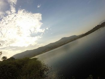 Scenic view of sea against cloudy sky