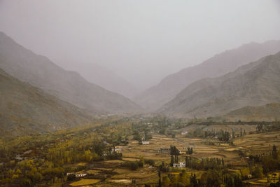 Scenic view of landscape and mountains against sky