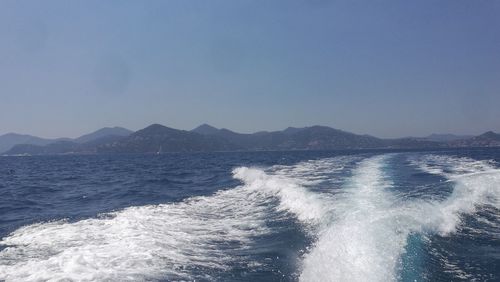 Scenic view of sea against clear blue sky