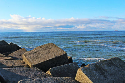 Scenic view of sea against cloudy sky