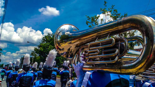 Band playing tuba during parade on street
