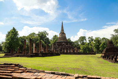 View of temple building against cloudy sky