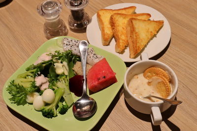 High angle view of breakfast served on table