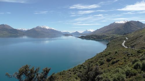 Scenic view of lake and mountains against sky