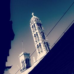 Low angle view of church against blue sky