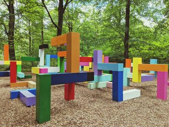 Row of multi colored chairs at cemetery