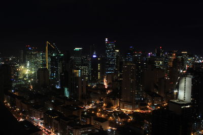 High angle view of illuminated buildings in city at night