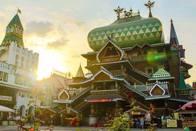 Traditional building against sky during sunset