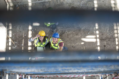 Construction worker talking to woman on a construction site