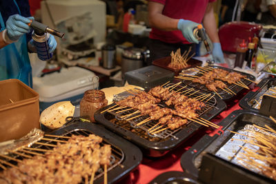 High angle view of meat on barbecue grill