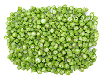 Directly above shot of green beans against white background