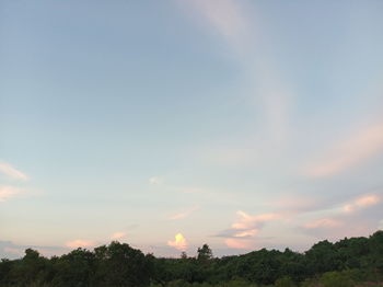 Scenic view of field against sky at sunset