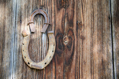 Horseshoe on old wooden door in the alps in austria