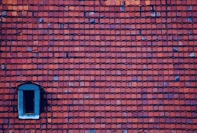 Close-up of brick roof tile on building