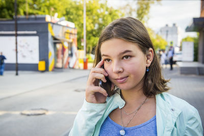 Close-up of teenage girl using mobile phone