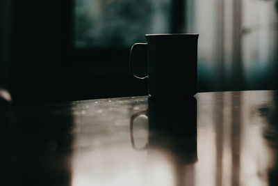 Close-up of coffee cup on table