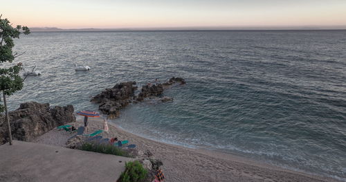 High angle view of beach against sky during sunset