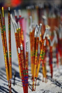 Extinguished incense sticks and ashes-red golden glossy paper-dafo si great buddha temple-china-1281