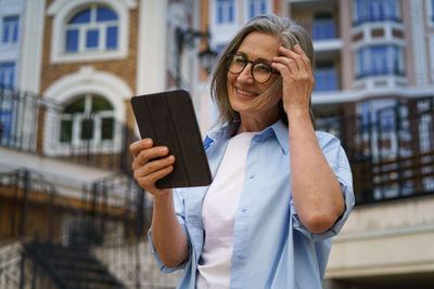 Young woman using mobile phone