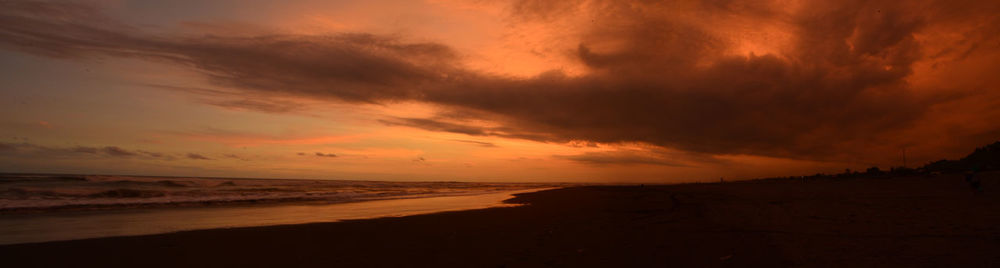 Scenic view of beach against sky during sunset