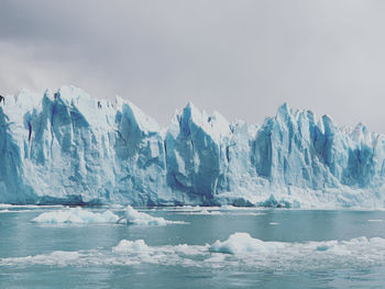 Scenic view of frozen sea against sky