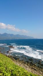 Scenic view of sea against blue sky