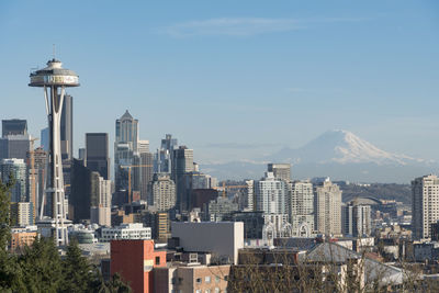 Space needle and buildings in city against sky