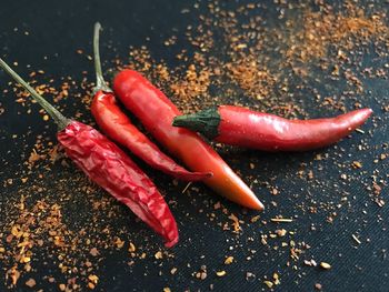 Close-up of red chili peppers on table