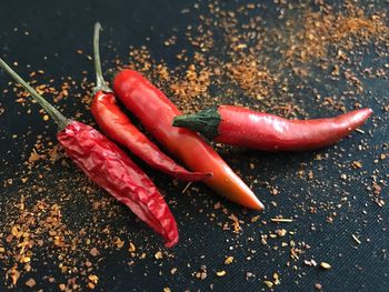 Close-up of red chili peppers on table